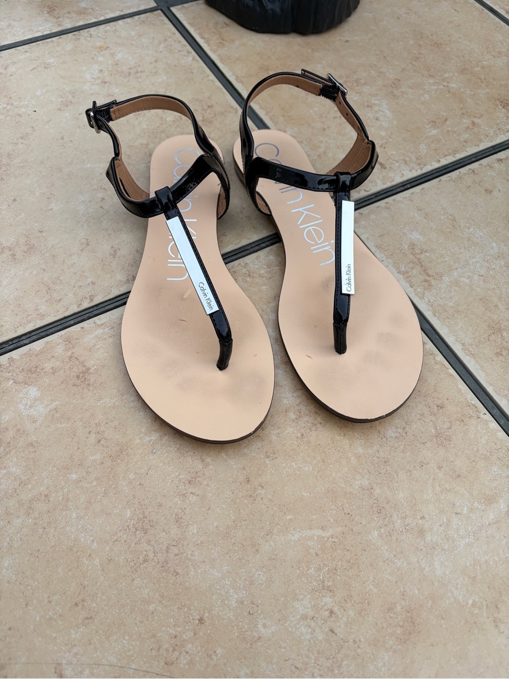 Calvin Klein Black Patent T-Strap Sandals with Silver Accent